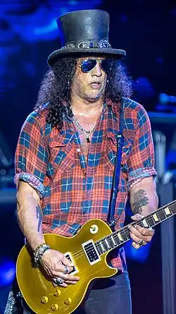 Slash playing guitar onstage