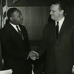 Martin Luther King Jr. shakes hands with Ned Breathitt.