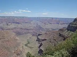(view due-north, northeast, from Bright Angel Trail, (South Rim section) – View of south-draining Bright Angel Canyon, containing in its lowest section with the Tapeats Sandstone, upon the Granite Gorge, the cliffs of gray-brown Muav Limestone (25% at base of Redwall Limestone), laid upon the slope-forming & greenish Bright Angel Shale. (The trail also descends/ascends through units on the South Rim, at near photo view.)