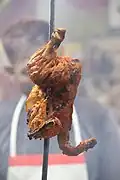 Tandoori chicken hanging at a restaurant in Agra, India.