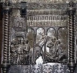 The gesture of the monk pointing over his shoulder is identical to that of the Virgin showing St. Francis to baby Jesus on a fresco by Pietro Lorenzetti in the Basilica of San Francesco d'Assisi.