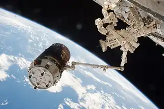 HTV-6 grappled to a robotic arm of ISS