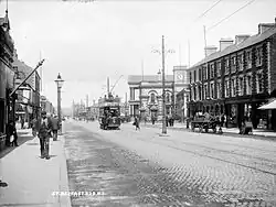 Circa 1907 with an electric tram near the Northern Counties Committee station at York Road railway station.