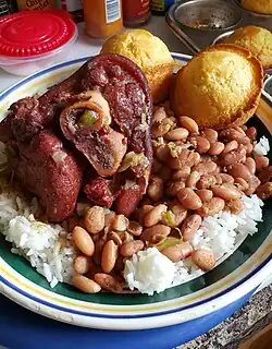 Ham hock cooked with pinto beans, served with white rice and cornbread.