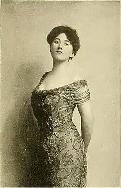 Youngish white woman in late Victorian day wear