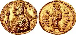 Another coin of Huvishka holding a scepter, with, on the reverse, deity Serapis (ϹΑΡΑΠΟ, "Sarapo")