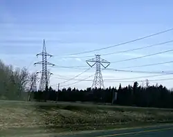 450 kV HVDC line (at right), on south side of Autoroute 20 east of the Nicolet station near Sainte-Eulalie, Quebec.