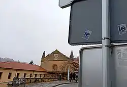 Two of the stickers next to the Segovia campus, in the background, calling for students to leave the city. These stickers, the result of social tension, are located throughout the city