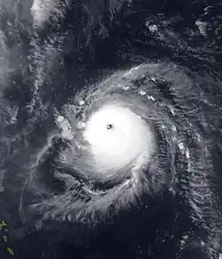 The image shows Hurricane Ike near peak intensity over open waters in the Atlantic Ocean. An eye can be seen at the center of the tropical cyclone.