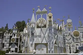 Gold leaf on the facade of "it's a small world"