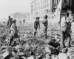 Japanese Imperial forces wounded surrender to US and Filipino soldiers under the United States Army and Philippine Commonwealth Army in unidentified city in Manila, May 1945.
