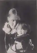 Photo of Julia Stephen with Virginia on her lap in 1884