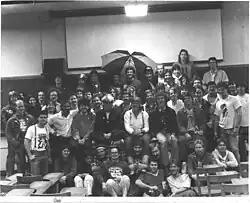 The Spring 1987 KMNR station photo in the old Mining Building. First row: Cindy Walk, Jennifer Jones, Brent Jones, Vito Biundo (Ex-Station Manager), ?, Gene Hoeltge, ?, Steve Hendren, George Carini (Dr. Sunshine Show), ?, ?. Second Row: Monster #?, ?, Bryan Adams, Jeff Brown, Jennifer Sommers, Jim Column, ?, ?, ?, ?. Third Row: Bald Dude, Kathy Dolsen (Former Personnel Director, Station Manager), ?, ?, Bob Linke, ?, James Haring, ?, ?, ?. Fourth Row: Scott Birdsong, Jeff Leith and Alletta Curtis (married), Eric Bussen, Dave Meriwether, ?, Mike Harvey (Ex-Station Manager), Rick Karbowski, ?, ?, ?, ?. Top Row: Doug Moyer, Kid with Had, ?, ?, Guy with Umbrella, Dean McDowell, Don Grahler, Greg Boice, Jim Calzone, Joe Heberlie, ?.