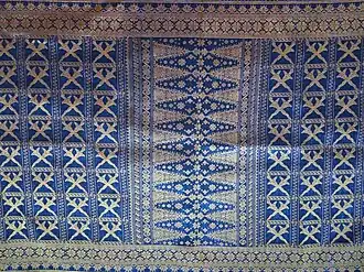 Songket fabric with keris motif with a bamboo shoot in the middle from West Sumatra, Pucuak rabuang is one of the Minangkabau traditional motifs.