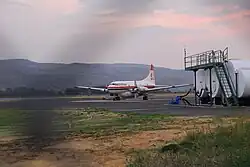 An airplane sits at a runway.