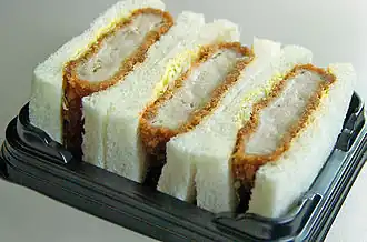 Katsu-sando served as an ekiben aboard a Shinkansen service