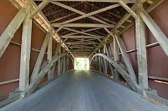The inside of the bridge showing the Burr arch trusses