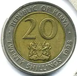 Face of coin showing figure 20 and the coat of arms of Kenya, surrounded by the words REPUBLIC OF KENYA, TWENTY SHILLINGS