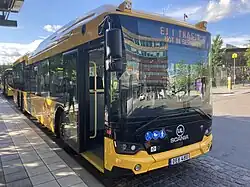 A yellow regional bus at the Uppsala Central Station.