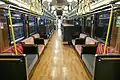 Semi-cross seating with sofa-style long seats, KiHa 110 Oykot train.