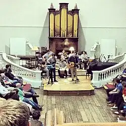 A youth band playing in the Room