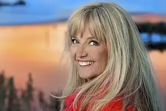 and when she represented Norway alone at the age of fifteen at the "Eurovision Song Contest 1971" with the song "Lykken er...".