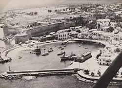 Aerial view of a town surrounding a harbour