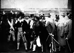 Still from La Revolución de Mayo (1909), directed by Mario Gallo, depicting men in 19th-century costumes; Argentina's first narrative film