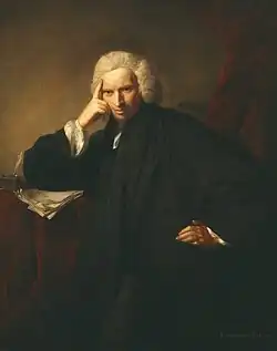 Painting of a smirking man in black clerical robes and wig