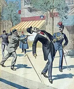 The illustration depicts Schinas shooting George in the back