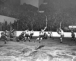 Red Wings and Maple Leaf game during the 1942 Stanley Cup Final, with Maple Leafs players celebrating moments after scoring a goal.
