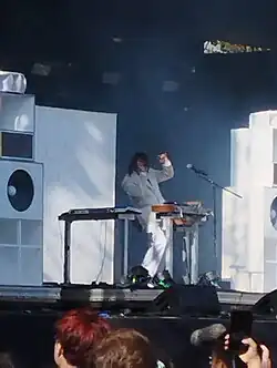 Lewis OfMan performing in 2022