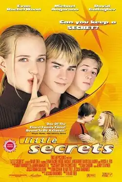The poster shows the three lead actors, Evan Rachel Wood, David Gallagher and Michael Angarano, against an orange backdrop. Wood is holding her index finger to her mouth.