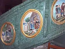 Scenes from the life of St Ronan on the polychrome pulpit at Locronan parish church.