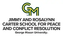 Logo for the Carter School with large GM in green and gold along with the name of the school