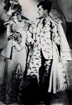 young white couple in extravagant Edwardian costumes