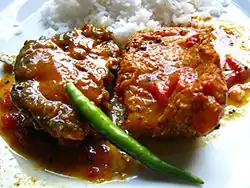 A traditional Bengali and Odia fish meal – Rice with Macher Jhol/Machha Jhola (Literally translated to "Fish's gravy")