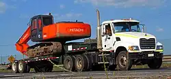 Semi-tractor with drop-deck trailer