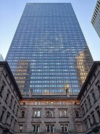 Looking up at the Palace Hotel's skyscraper from ground level, with the Villard Houses in the foreground