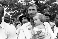 Image 17Man with child at a meeting of the Southern Tenant Farmers Union, 1937 (from History of Arkansas)