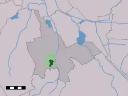 The village centre (dark green) and the statistical district (light green) of Vries in the municipality of Tynaarlo.