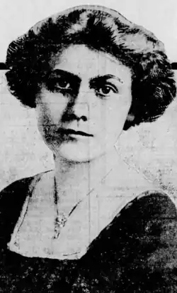 A young white woman with dark hair and eyes