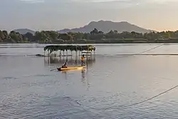 Mekong pirogue at sunset, Don Puay