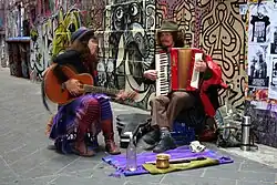 Buskers perform in front of street murals near Degraves Street, 2007