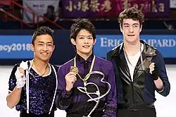 The men's event medalists at the 2010 Trophée Éric Bompard