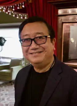 A headshot of Michael Goi.