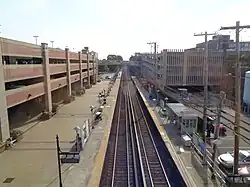 The Mineola Intermodal Center (bottom left), as seen prior to the commencement of the construction of the Main Line's third track.