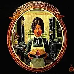 a woman licking her lips and holding a pie with a slice removed showing a subtle depiction of a woman's vulva and some semen leaking from the pie