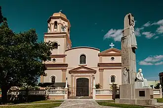Western façade of the church and Salvador Brau Monument