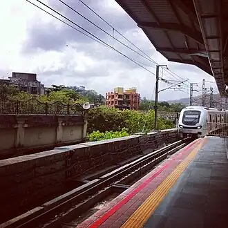 Mumbai Metro train arriving at Ghatkopar